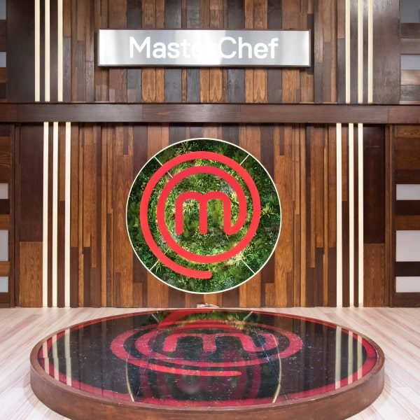 masterchef logo on artificial plant wall 