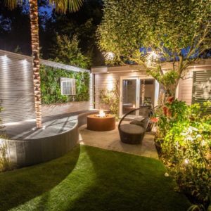 Beautifully lit garden with living wall feature