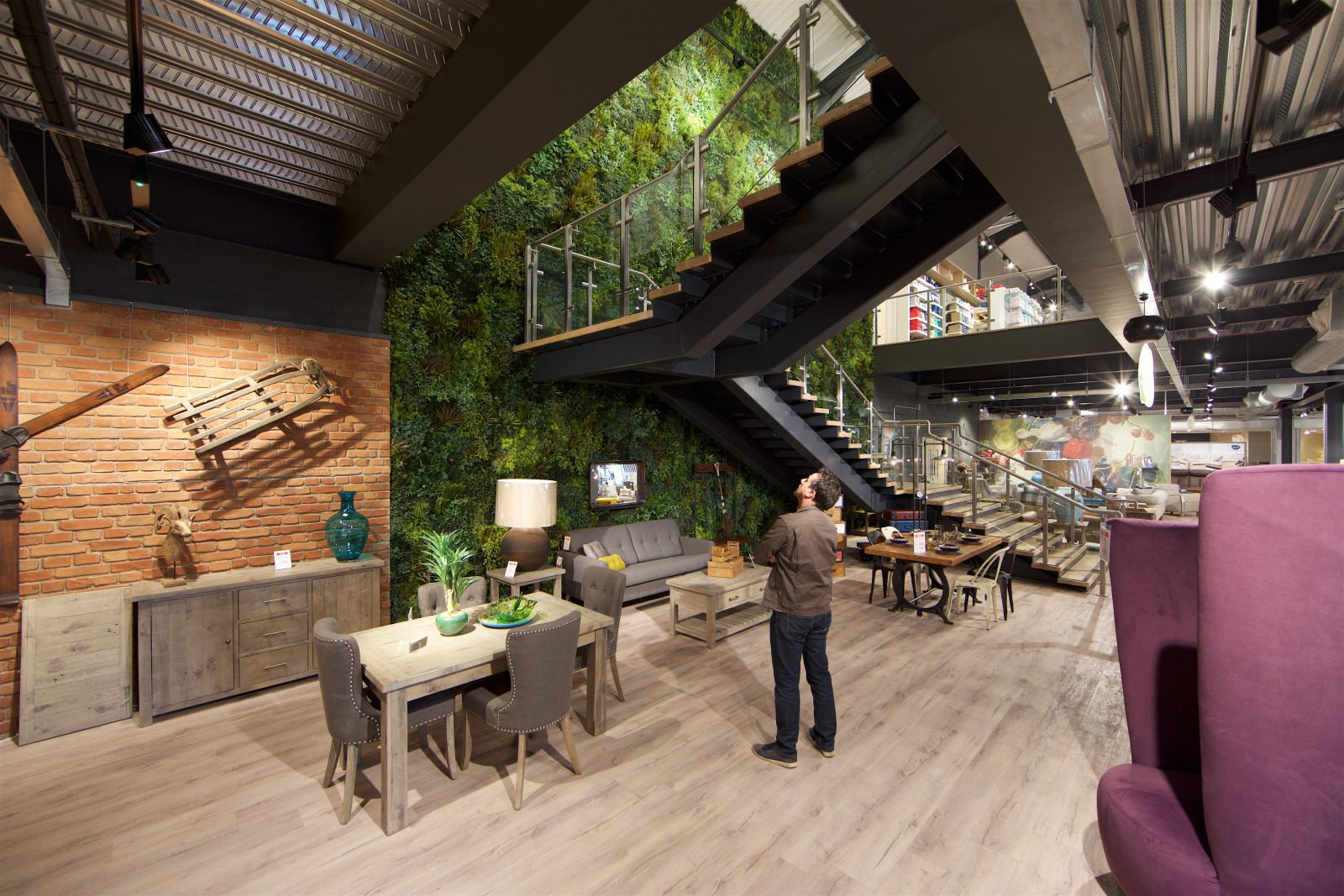 Stairs in front of a beautiful artificial green wall