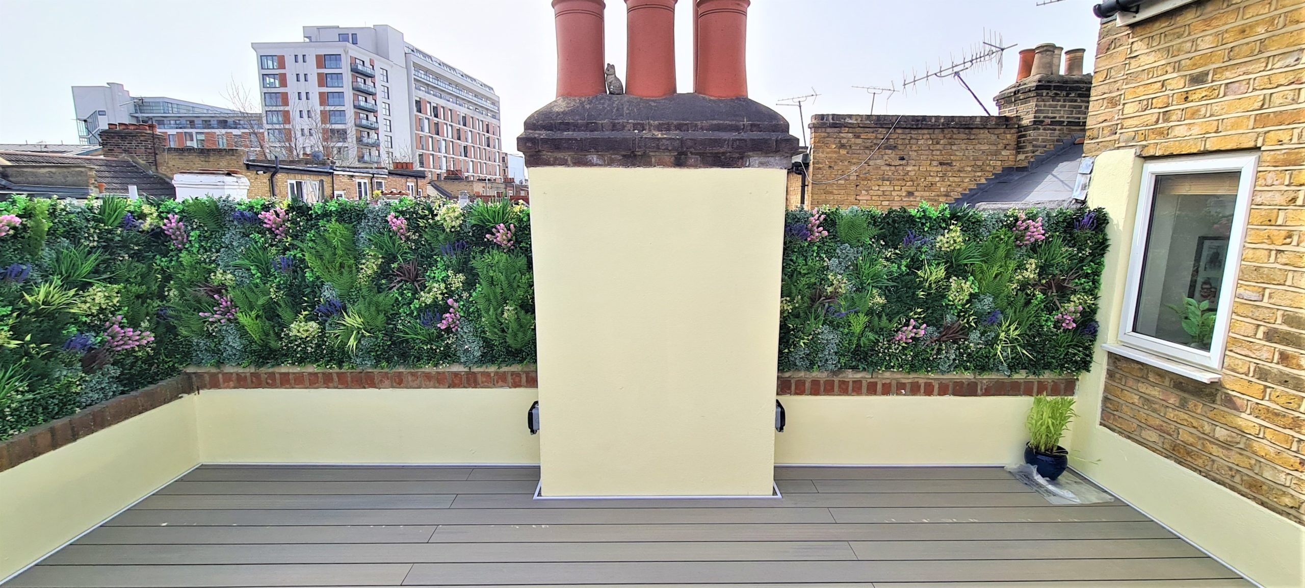 An replica living green wall installation by Vistafolia on a London roof terrace