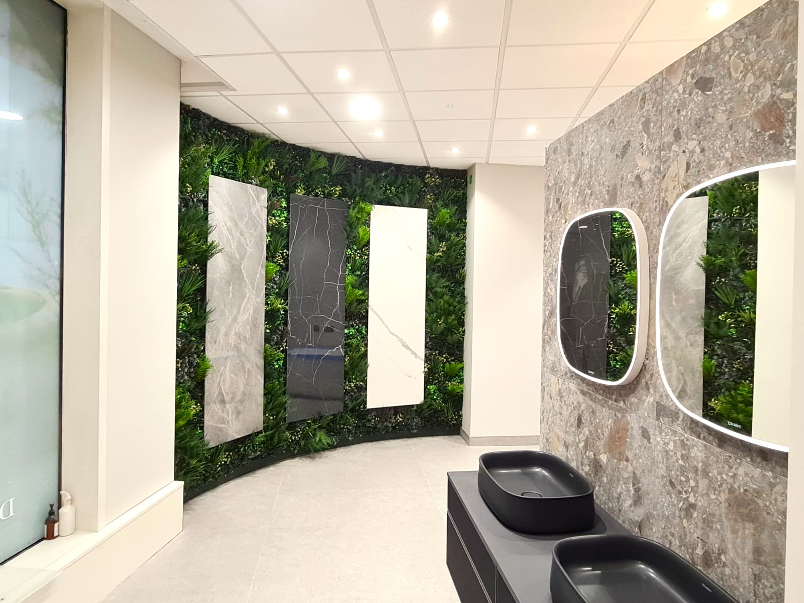 Vistafolia artificial green wall in a bathroom showroom in Windsor