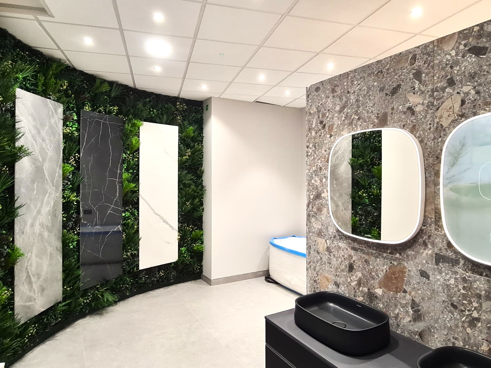 Vistafolia artificial green wall in a bathroom showroom in Windsor