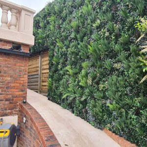 artificial green wall privacy screen in a garden