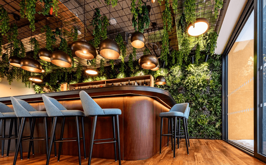 Artificial Green Wall with hanging foliage in bar